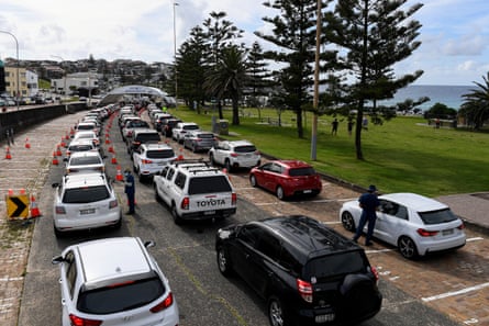 Three lanes of cars queued at a Covid testing station in Bondi