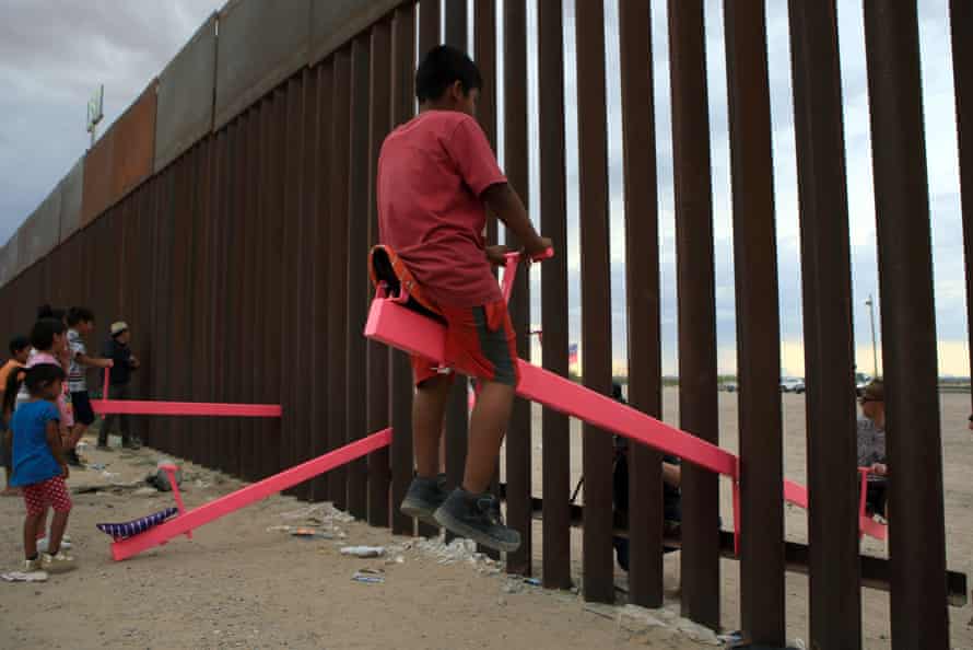 Ciudad Juárez, Mexico, July 2019: seesaws have been built across the US-Mexico border to bring a playful concept of unity to the two sides of the divide.