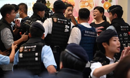 Former Hong Kong Journalists Association president Mak Yin-ting (right) was arrested 