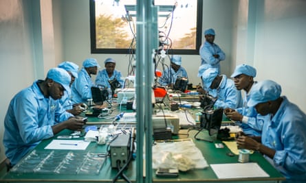 Employees construct mobile phones in a factory in Brazzaville.