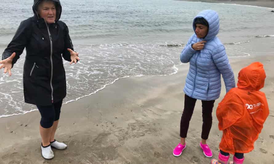 Marie Power explains seaweed foraging to visitors to Kifarrasy strand, Waterford, Ireland.