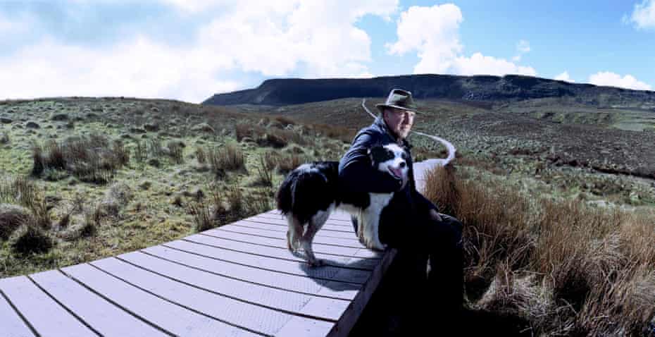 John Sheridan, a farmer and landowner, stands beside the Cuilcagh mountain boardwalk, peering out at the border in Florencecourt, Northern Ireland