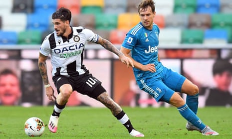 Rodrigo De Paul turns away from Juventus’ Aaron Ramsey during Udinese’s 2-1 win in July. 