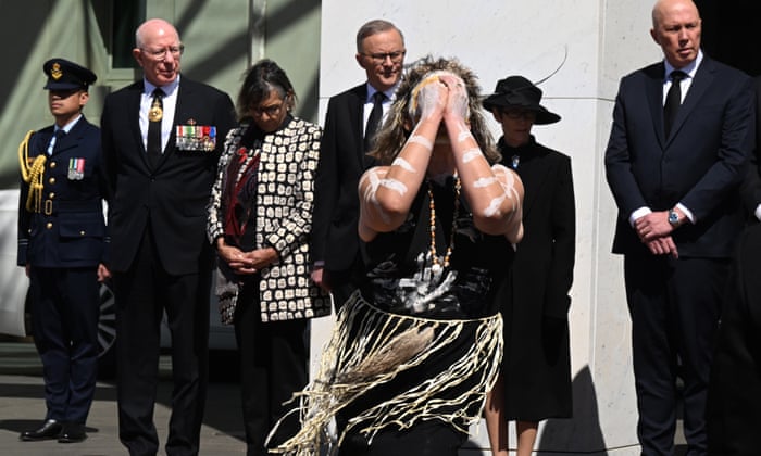 An indigenous dancer performs as Governor-General David Hurley (R) and Australian Prime Minister Anthony Albanese (C) look on during the Proclamation of King Charles III, on the forecourt of Parliament House, in Canberra, Australia, 11 September 2022.
