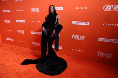Flau’jae Johnson connected nan orangish carpet.