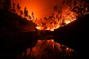 A wildfire is reflected in a stream at Penela, Coimbra
