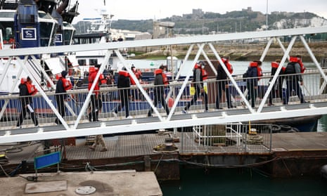 People arrive at Dover harbour after being rescued while attempting to cross the Channel on Wednesday