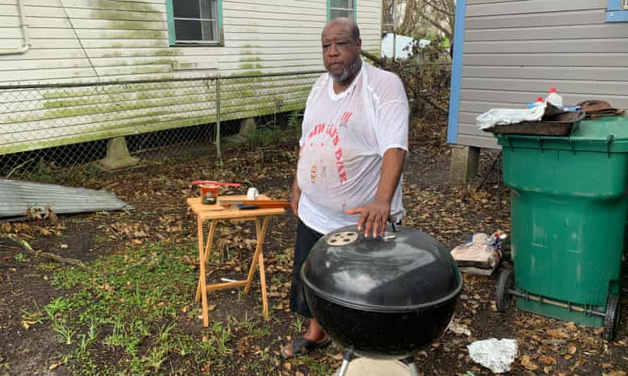 Brian Millet beside his barbecue at his Ida-damaged home in Reserve, Louisiana