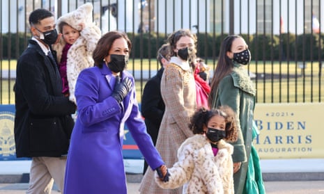 Kamala Harris walks with family down Pennsylvania Avenue in Washington DC on 20 January. 