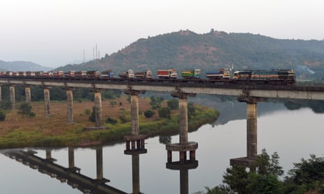 A diesel locomotive carrying loaded lorries on Shashtri bridge near Sangmeshwar, in Maharastra. 