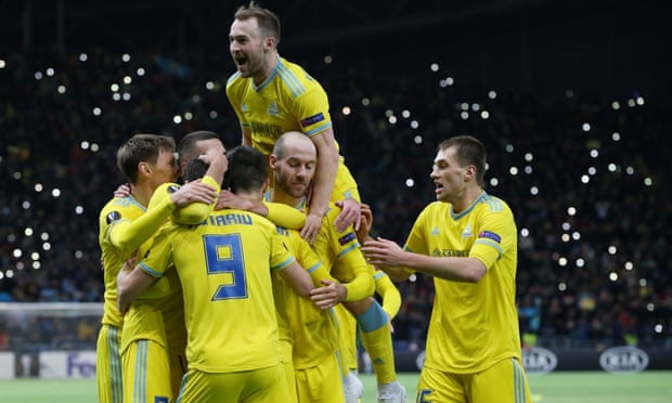 Astana players celebrate after Manchester United’s Di’Shon Bernard scores an own goal to give Astana a 2-1 lead.