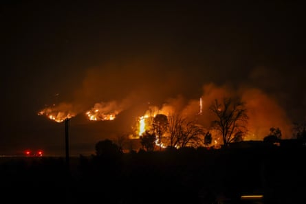 Firefighters battle with flames during wildfire