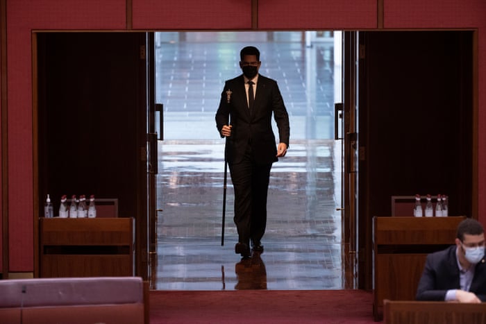 The Black Rod arrives back from summoning the members of the House of Representatives for the joint sitting where the Governor-General David Hurley officially opened the 47th parliament