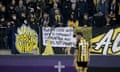 Vitesse Arnhem supporters with a banner saying ‘Football clubs were born to represent communities, not fans’ at a home match with Twente in March 2024