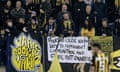 Vitesse Arnhem supporters with a banner saying ‘Football clubs were born to represent communities, not fans’ at a home match with Twente in March 2024