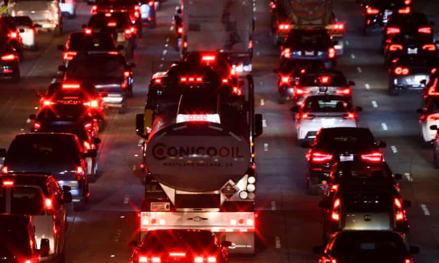vehicles travel at night on a busy highway