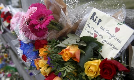 A message is left among flowers near to the location where a Hawker Hunter fighter jet crashed onto the A27 road at Shoreham near Brighton, Britain August 24, 2015. The death toll after a vintage fighter jet ploughed into a busy road in southern England while performing an acrobatics display could approach 20, police said on Monday, as Britain announced new safety restrictions on airshows. REUTERS/Luke MacGregor