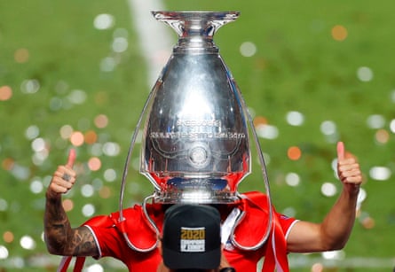 Lucas Hernandez of Bayern Munich poses with the Champions League trophy in Lisbon