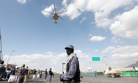 A Houthi-operated helicopter flies over Houthi troopers standing guard during a protest in Sana’a, Yemen, last week in solidarity with Palestinians and against the US-led operation to safeguard Red Sea shipping