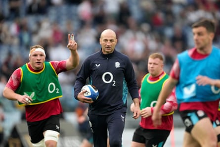 Steve Borthwick watches his England players warm up