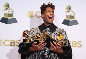 Jon Batiste poses with his awards at the 64th annual Grammy awards at the MGM Grand Garden Arena in Las Vegas