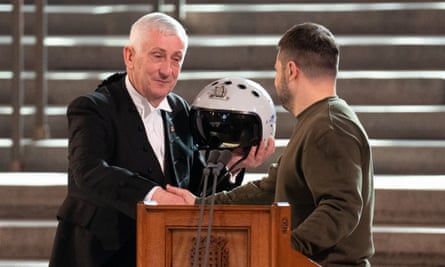 Speaker of the House of Commons, Lindsay Hoyle (left), is presented with a Ukrainian fighter pilot’s helmet by Voldoymyr Zelenskiy.