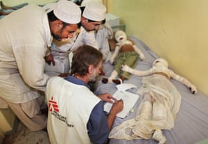 An MSF worker attends to a five-year-old boy and his six-year-old sister who were severely burned after they came across a landmine and threw it in a fire, where it exploded. The incident happened Naw Zad district in Helmand province. Their father searched for a car he could borrow for full day before he was able to bring his children to Boost hospital in Lashkargah, Helmand province.