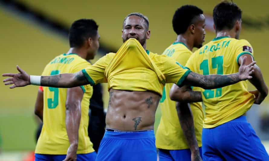 Neymar lifts his shirt after scoring against Peru, in response to suggestions he is overweight.