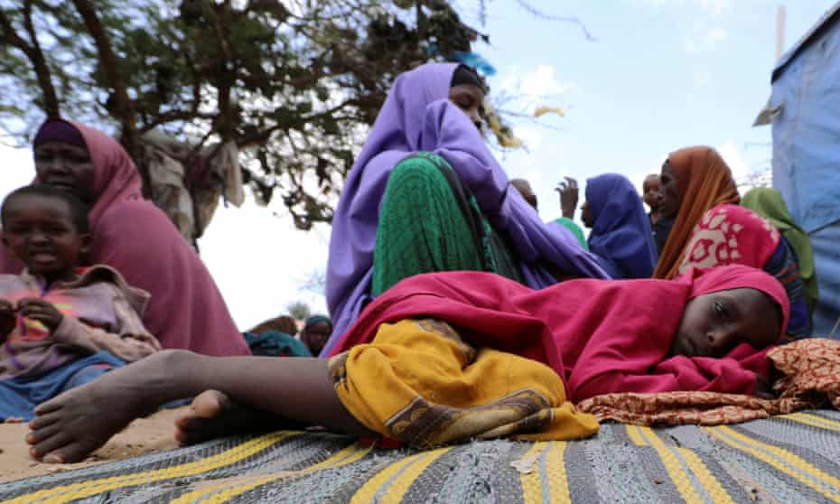 Somali girl rests at a camp near Mogadishu