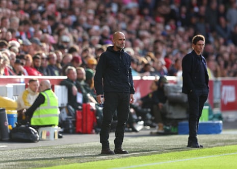 City manager Pep Guardiola on the touchline alongside Brentford Manager Keith Andrews.