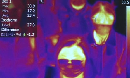 Scanning the body heat of passengers at Rome airport.