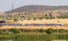 Automotive train of travelers, with diesel traction used as regional transport in Spain as it passes through Merida with the Guadiana River in the for<br>RN85F3 Automotive train of travelers, with diesel traction used as regional transport in Spain as it passes through Merida with the Guadiana River in the for