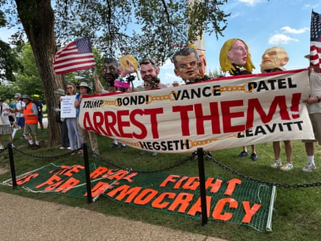 Dozens of protesters stood south of the White House to protest Sunday’s UFC fights, under the banner ‘The Real Fight is for Democracy.’