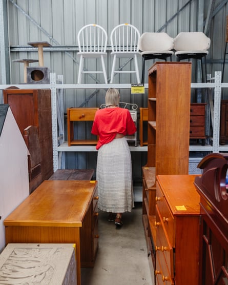 Jaharn Quinn looks at furniture in a warehouse