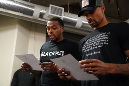 Sterling Brown and George Hill of the Milwaukee Bucks read a statement to the media on 26 August 2020 at AdventHealth Arena at ESPN Wide World of Sports Complex in Orlando, Florida.