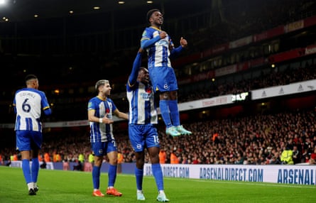 Danny Welbeck gives Tariq Lamptey a lift after his teammate scores at Arsenal in the Carabao Cup this season.