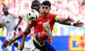 Álvaro Morata looks to hold off Germany's Antonio Rüdiger