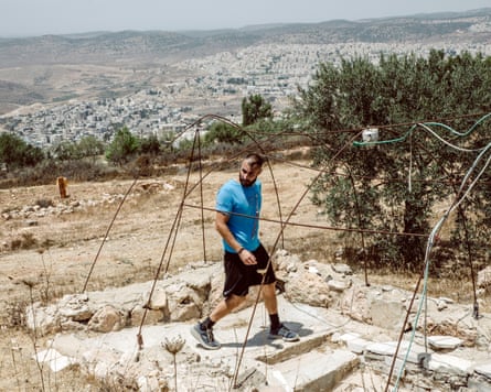 An international volunteer works on the Nassar family’s farm