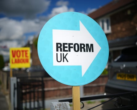 Neighbouring homes in Ashton-in-Makerfield show their support for Labour and Reform UK, 10 June 2026.