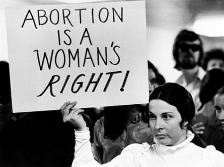 A young woman holds a sign demanding a woman’s right to abortion at a demonstration to protest against the closing of a Madison abortion clinic in Madison, Wis., 20 April 1971. The Midwest Medical Center was closed after authorities said more than 900 abortions had been performed at the facility in violation of the state’s abortion laws. The protest is held at the Dade County building. (AP Photo)
