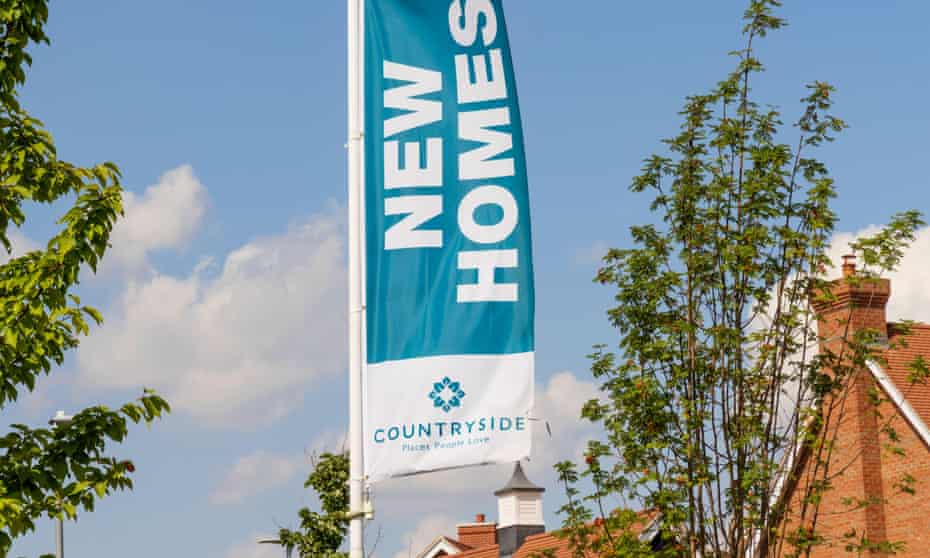 Countryside Properties advertising flag banner at a new housing development.
