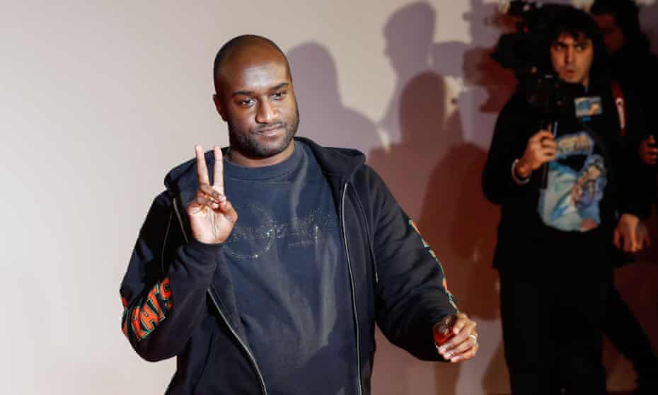 Virgil Abloh acknowledges applause at the men’s fall/winter 2018/19 collection he designed for Off White in Paris