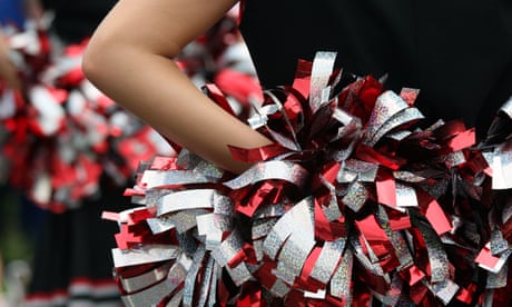 Young cheerleader with red silver and black pompom Young cheerleader with red silver and black pompom