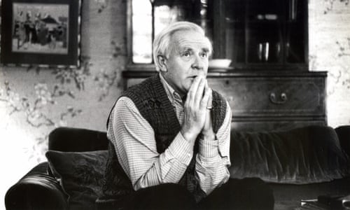 john le carre on sofa black and white picture