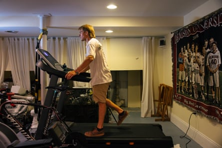 A man walks on a treadmill inside