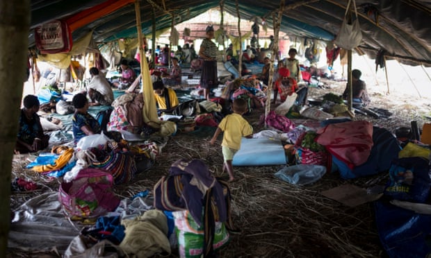 Families rest at a temporary shelter in Pimaga, Papua New Guinea, after powerful earthquakes.