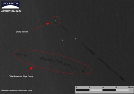 A satellite image showing a black streak on the surface of the sea with markings to indicate the likely site of the discharge