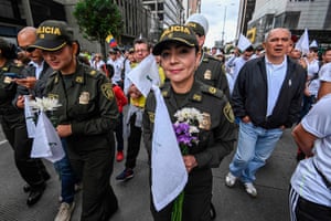 Bogotá, ColombiaPolice officers march in support of victims of a car bombing and their relatives that left 20 people dead at the police academy.
