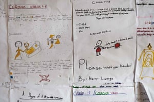 Drawings about coronavirus on the walls of Clarke junior school in Kampala last April. The drawings were made by pupils just before schools closed.
