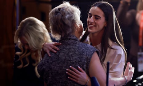 Caitlin Clark hugs the Iowa head coach Lisa Bluder after being selected first overall by the Indiana Fever